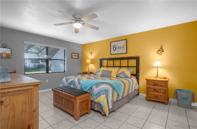 tiled bedroom with ceiling fan