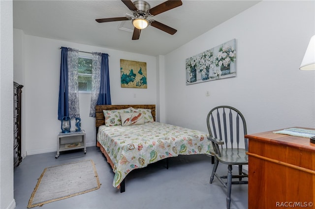 bedroom with concrete flooring and ceiling fan