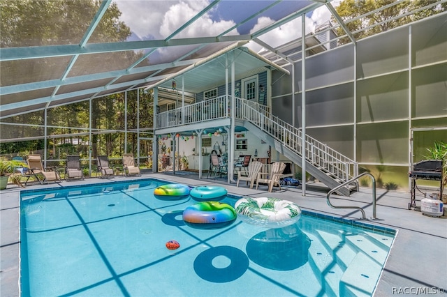 view of pool featuring a patio area and a lanai