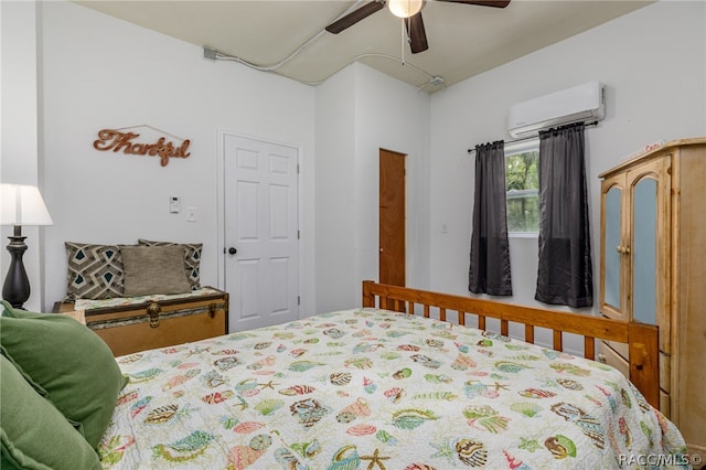 bedroom featuring ceiling fan and a wall unit AC