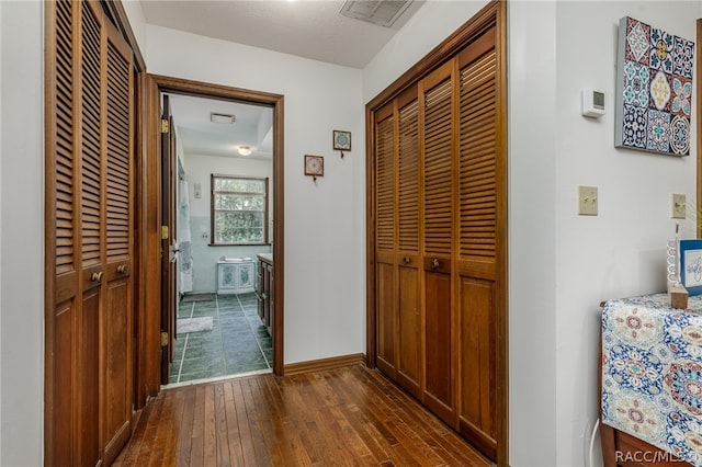 hall featuring dark hardwood / wood-style flooring