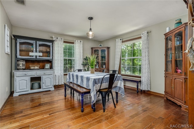 dining space featuring hardwood / wood-style flooring