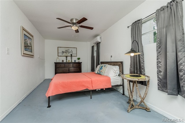 bedroom featuring a textured ceiling, ceiling fan, concrete floors, and a wall mounted air conditioner