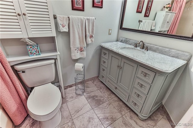 bathroom with marble finish floor, baseboards, vanity, and toilet