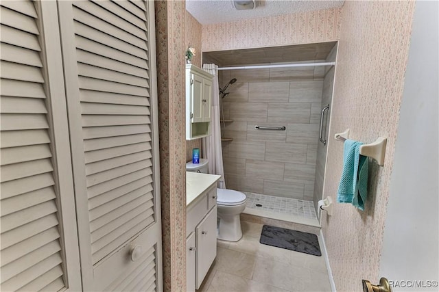 bathroom with wallpapered walls, toilet, a stall shower, vanity, and tile patterned floors