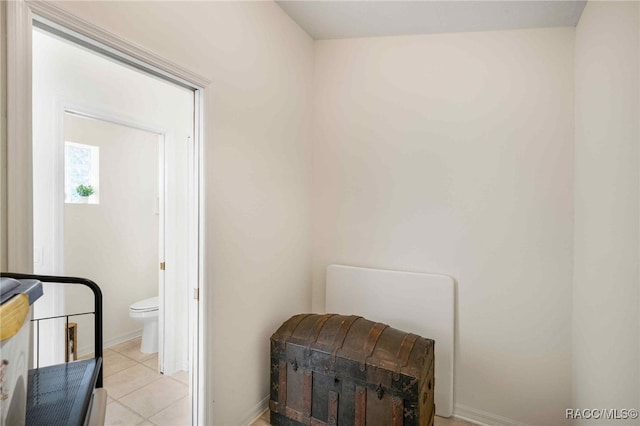 1150 E Cleveland St, Hernando, FL 34442 - laundry room with light tile patterned floors and baseboards