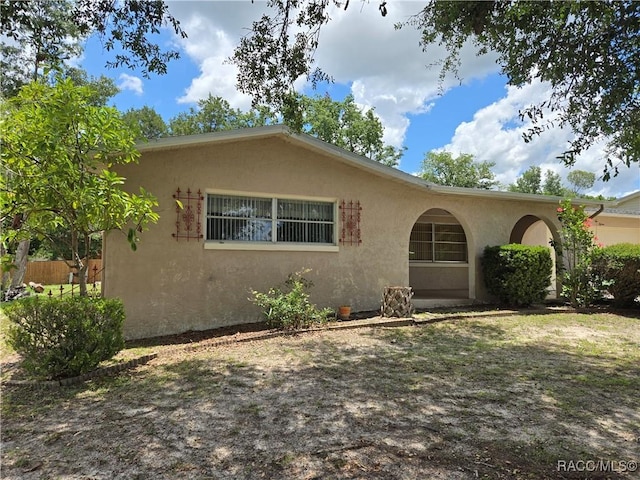 215 S Jefferson St, Beverly Hills, FL 34465 - view of front of home with stucco siding