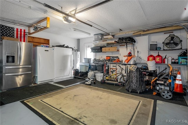 483 N Turkey Pine Loop, Lecanto, FL 34461 - garage with stainless steel fridge with ice dispenser, a garage door opener, and freestanding refrigerator