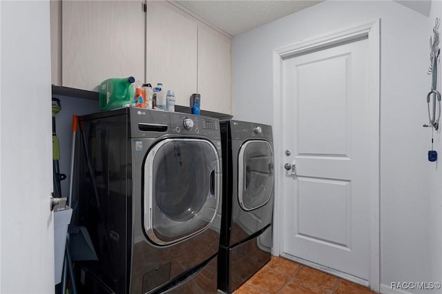 483 N Turkey Pine Loop, Lecanto, FL 34461 - laundry area with light tile patterned floors, a textured ceiling, washer and dryer, and laundry area