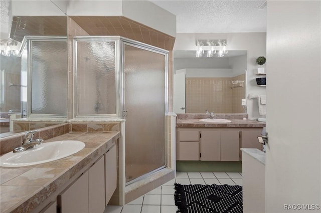 483 N Turkey Pine Loop, Lecanto, FL 34461 - bathroom featuring tile patterned floors, a sink, a textured ceiling, and a stall shower