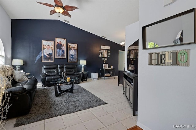 483 N Turkey Pine Loop, Lecanto, FL 34461 - living room featuring visible vents, an accent wall, lofted ceiling, a ceiling fan, and light tile patterned floors