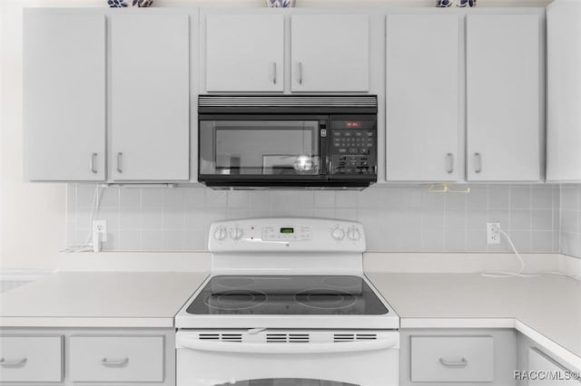 kitchen with white range with electric cooktop, white cabinetry, and tasteful backsplash