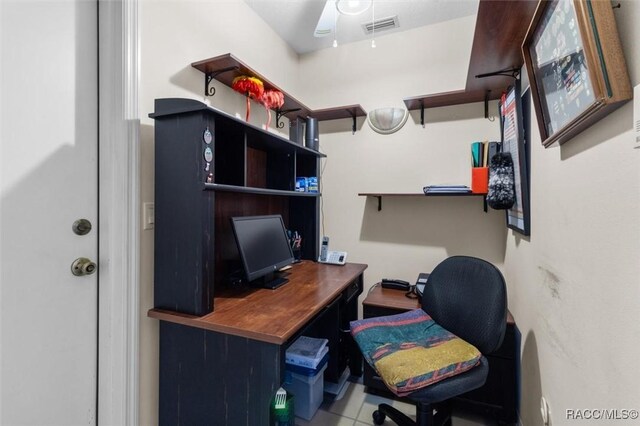 office area featuring tile patterned floors and ceiling fan