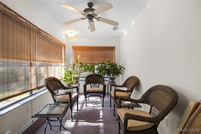 living area featuring ceiling fan