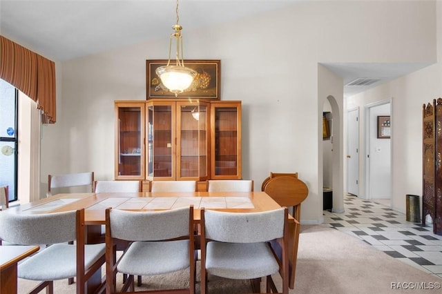 dining space with lofted ceiling