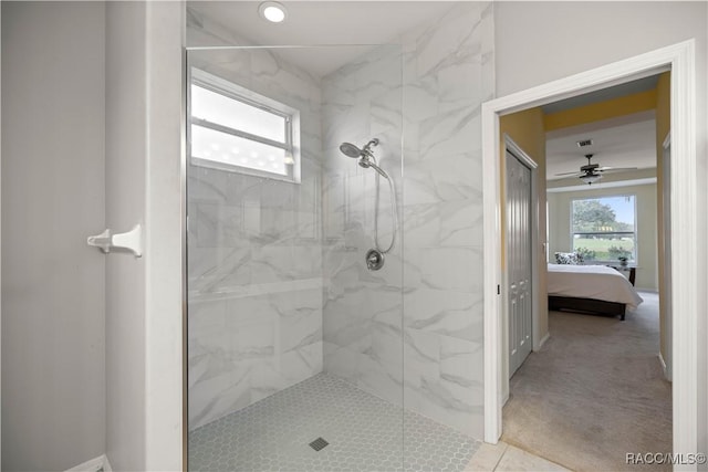 bathroom with tiled shower