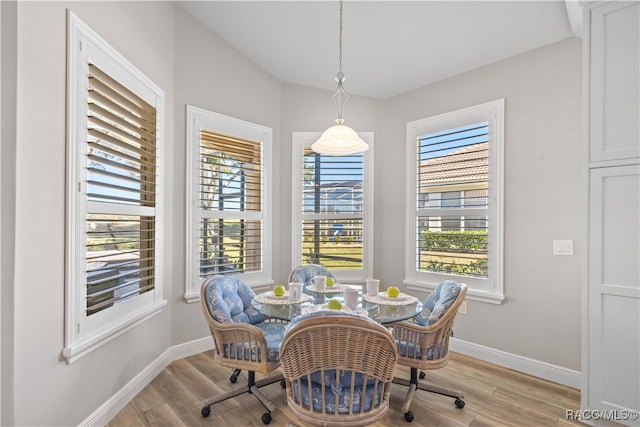 dining room with light wood-style flooring and baseboards