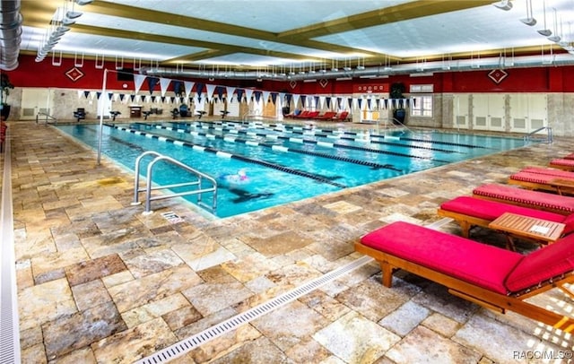 view of swimming pool featuring a patio area