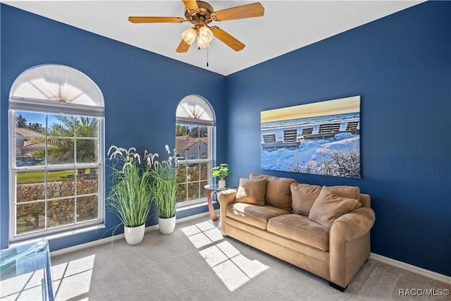 sitting room with light carpet and ceiling fan