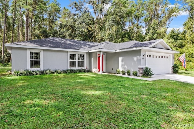 ranch-style house featuring a front yard and a garage