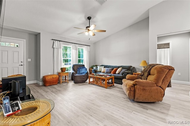 living room with light hardwood / wood-style flooring and ceiling fan