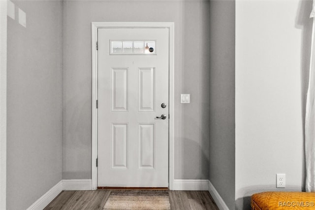 doorway with hardwood / wood-style flooring