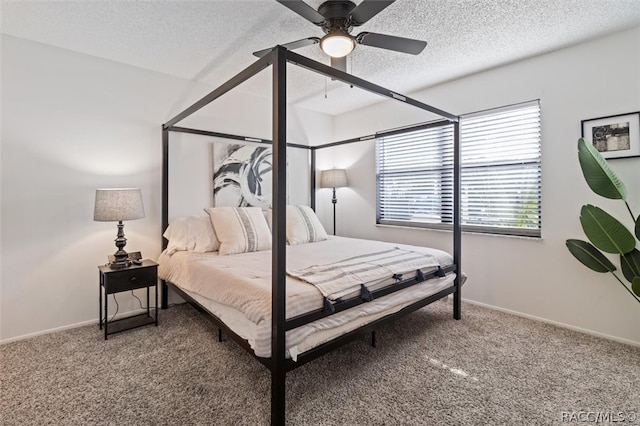 carpeted bedroom featuring a textured ceiling, vaulted ceiling, and ceiling fan