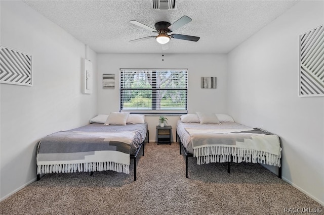 bedroom with carpet flooring, a textured ceiling, and ceiling fan