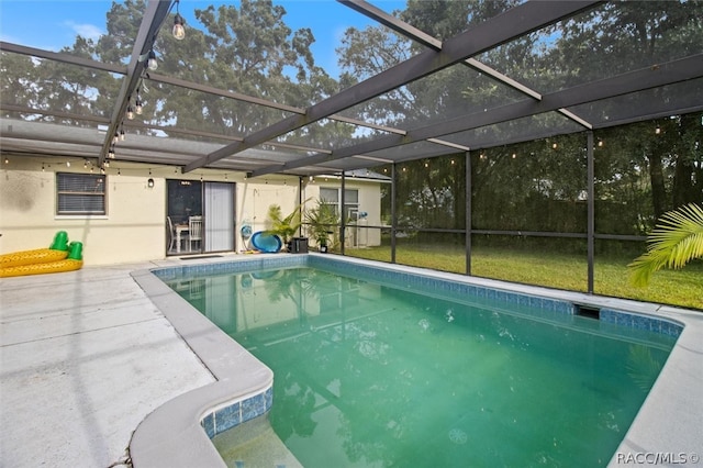 view of pool with a patio area and a yard