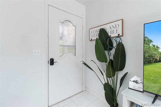 entryway with light tile patterned floors