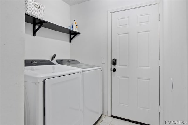 clothes washing area featuring washer and dryer