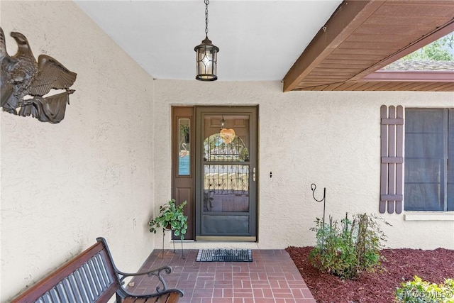 doorway to property with stucco siding