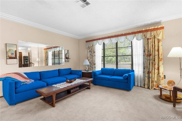 living area with crown molding, carpet flooring, a textured ceiling, and visible vents