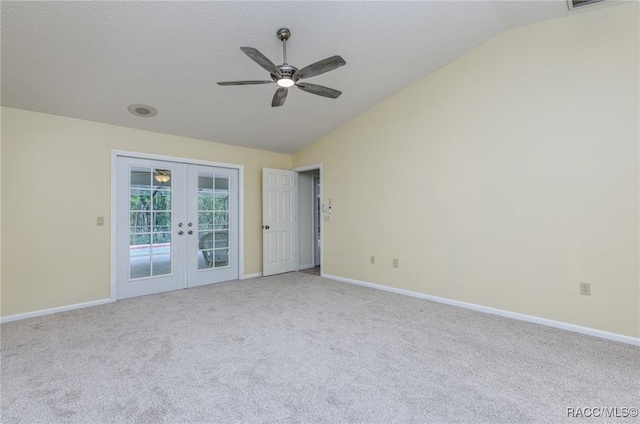 4 Chinkapin Ct, Homosassa, FL 34446 - empty room with carpet flooring, french doors, baseboards, ceiling fan, and vaulted ceiling