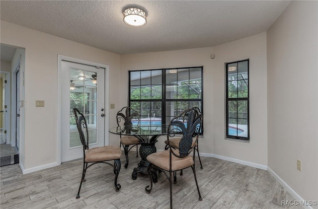 4 Chinkapin Ct, Homosassa, FL 34446 - dining space featuring baseboards, light wood finished floors, and a wealth of natural light