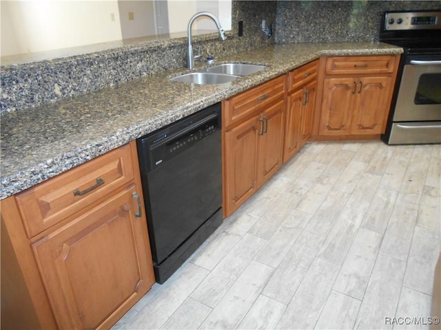 4 Chinkapin Ct, Homosassa, FL 34446 - kitchen featuring a sink, stainless steel range with electric cooktop, dishwasher, brown cabinets, and dark stone countertops