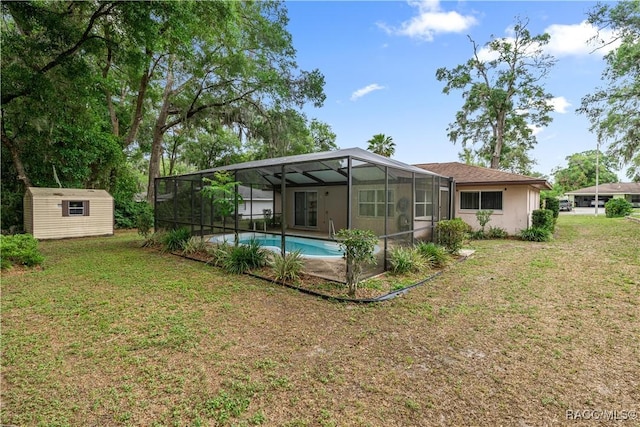 522 Hiawatha Ave, Inverness, FL 34452 - back of property featuring a storage unit, an outdoor structure, a yard, an outdoor pool, and a lanai