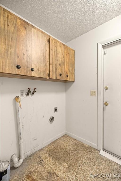 522 Hiawatha Ave, Inverness, FL 34452 - laundry area featuring hookup for an electric dryer, cabinet space, and a textured ceiling