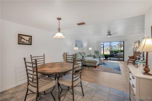 dining room with light hardwood / wood-style floors and ceiling fan