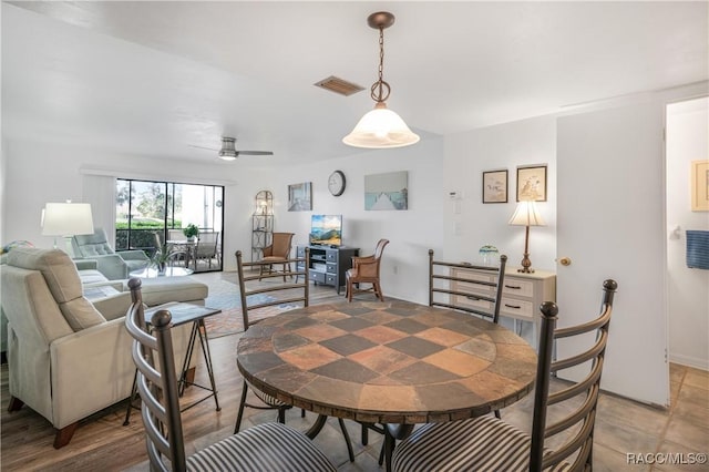 dining space with ceiling fan