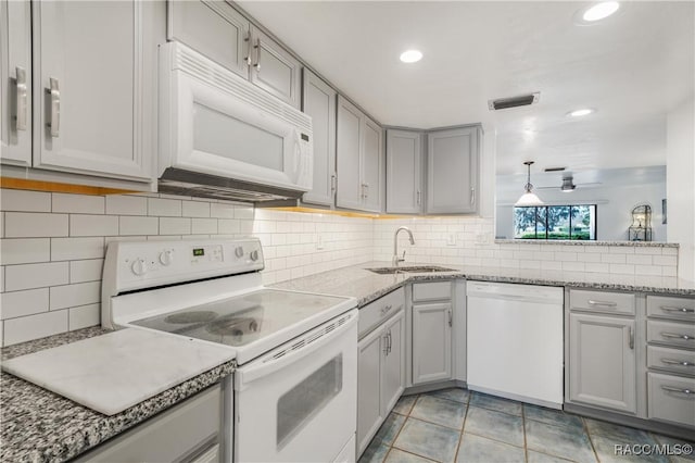 kitchen featuring pendant lighting, white appliances, sink, ceiling fan, and light tile patterned floors