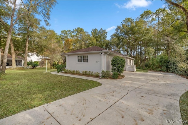 view of home's exterior with a lawn