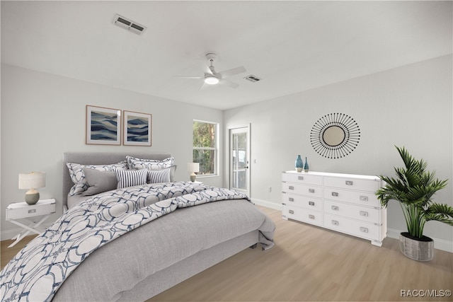 bedroom with ceiling fan and light wood-type flooring