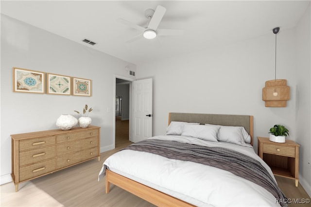 bedroom featuring ceiling fan and light hardwood / wood-style floors