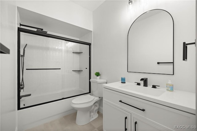 full bathroom with vanity, enclosed tub / shower combo, and toilet