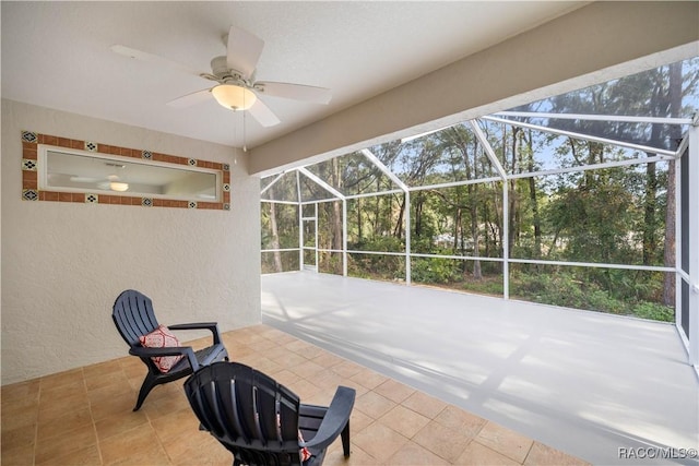 view of patio / terrace with glass enclosure and ceiling fan