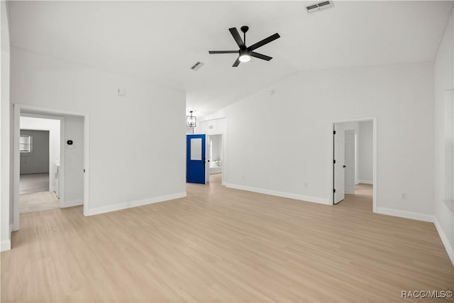 unfurnished living room featuring ceiling fan, light hardwood / wood-style floors, and vaulted ceiling