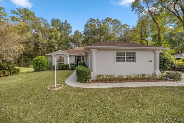 ranch-style house with a front lawn