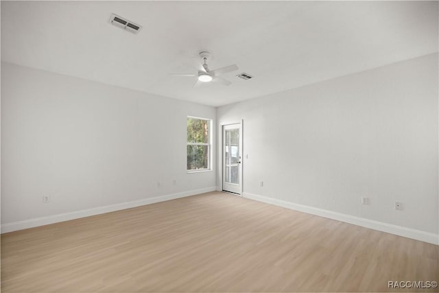 unfurnished room with light hardwood / wood-style flooring and ceiling fan