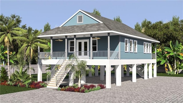 rear view of house with ceiling fan, covered porch, and a carport